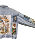 Denim jacket with mushroom and fairy design on a white background