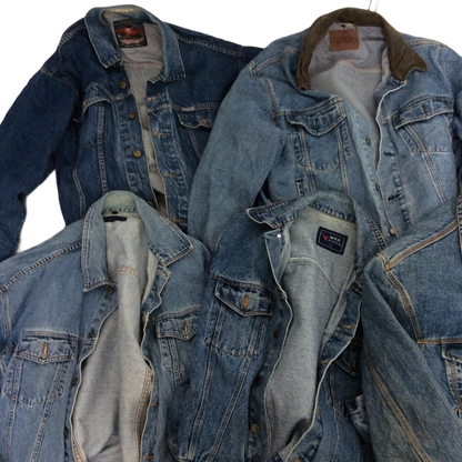 a pile of blue jean jackets sitting on top of each other