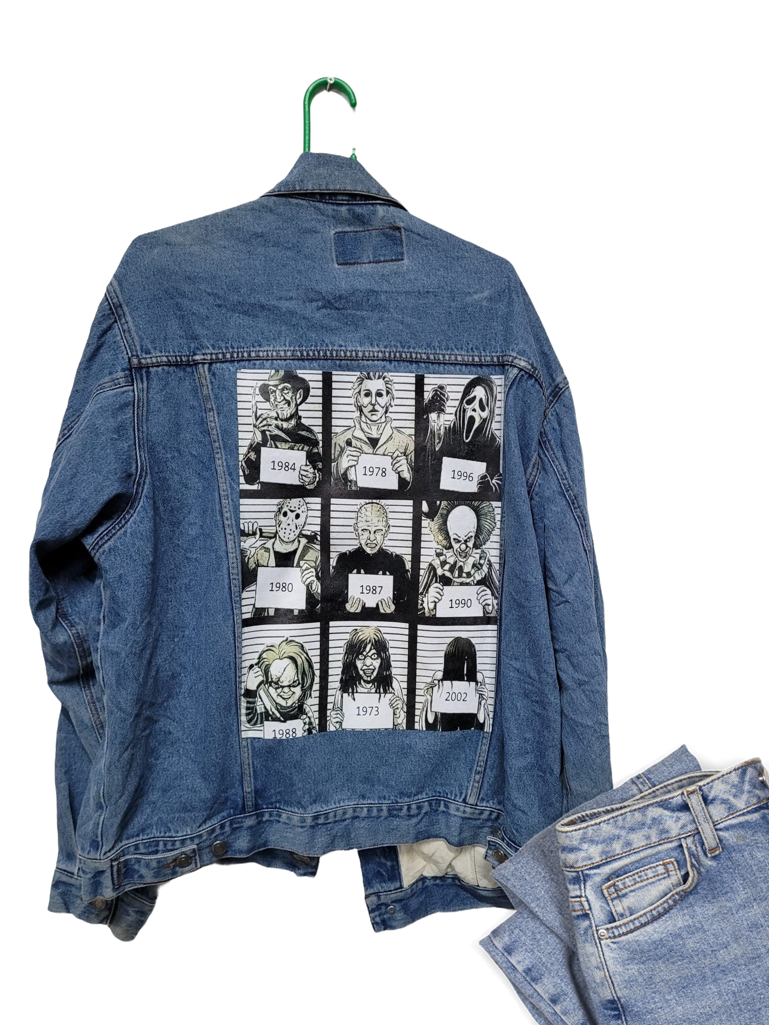 a jean jacket with pictures of people on it