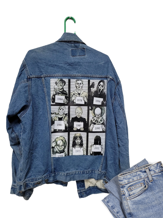 a jean jacket with pictures of people on it