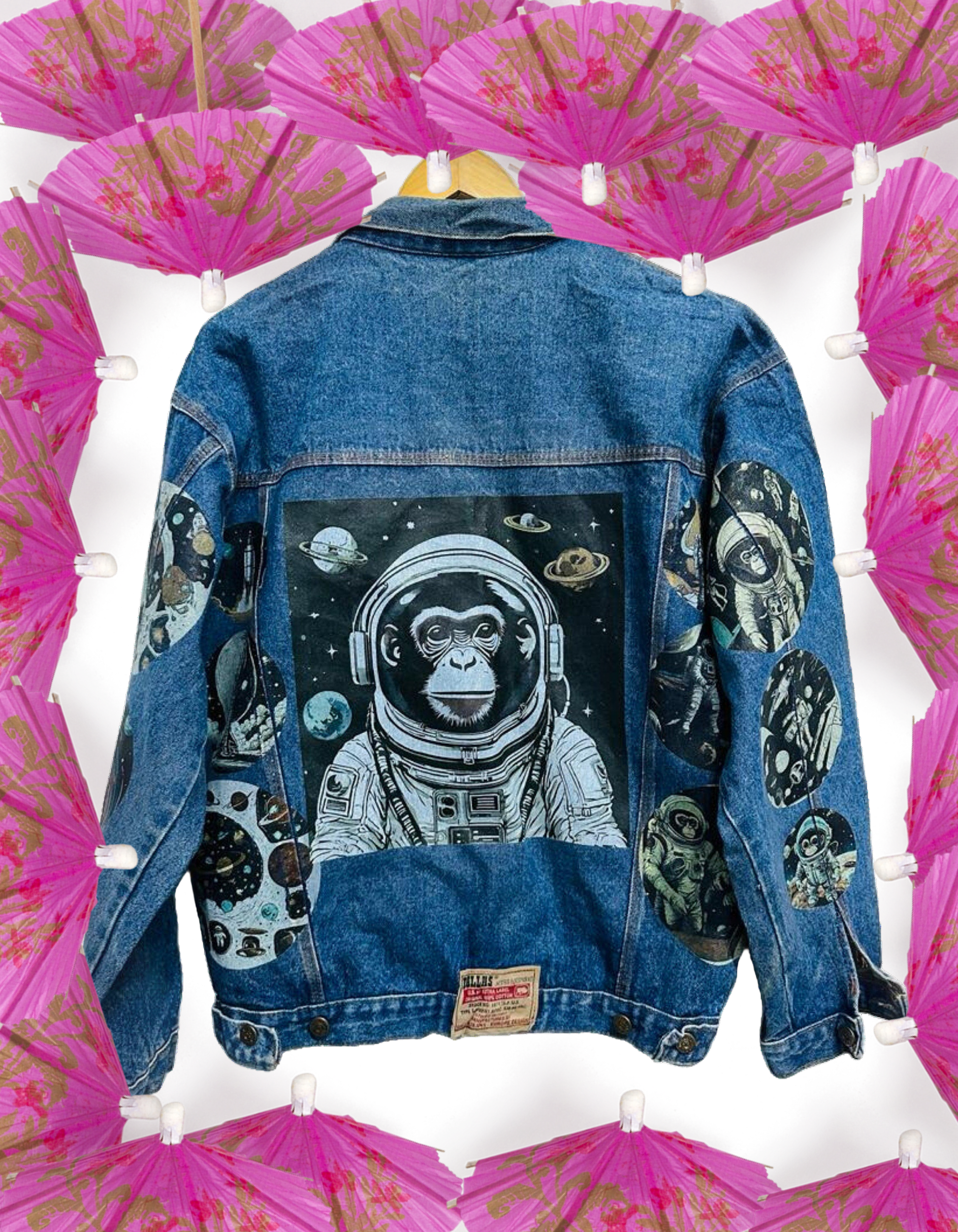 a denim jacket with a picture of an astronaut monkey on it