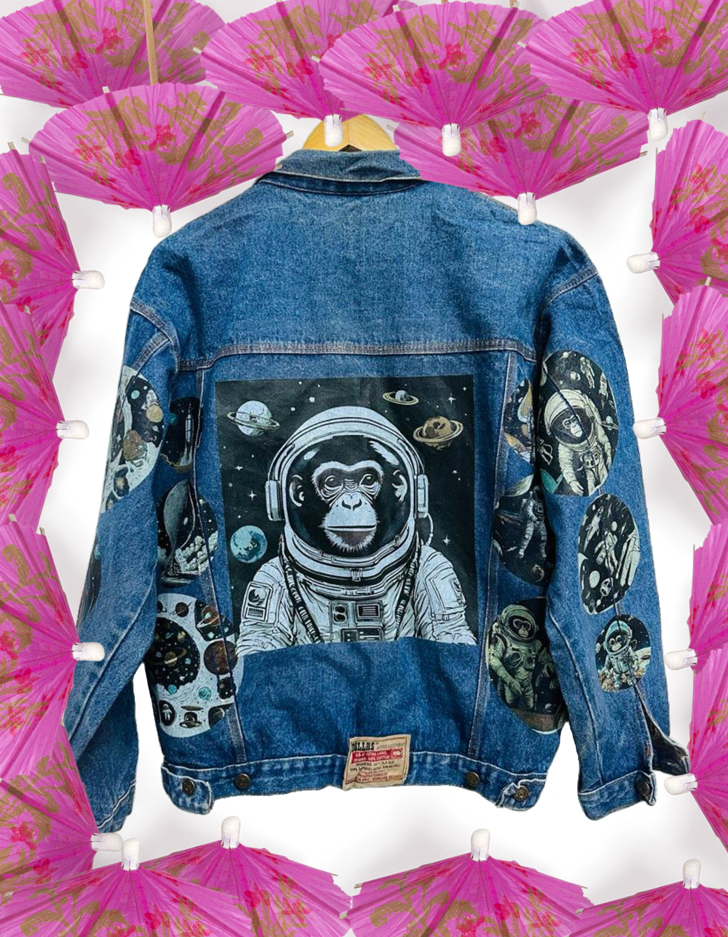 a denim jacket with a picture of an astronaut monkey on it